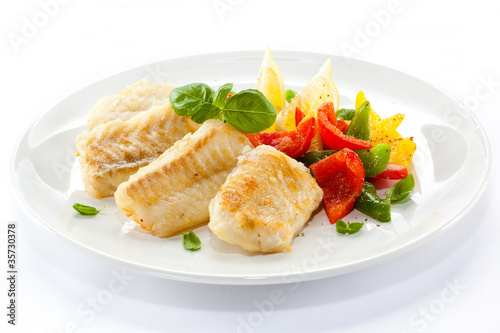 Photo: Fish dish - fried fish fillets and vegetables Fish dish - fried fish fillets and vegetables