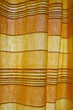 Sunlight through yellow and orange curtain