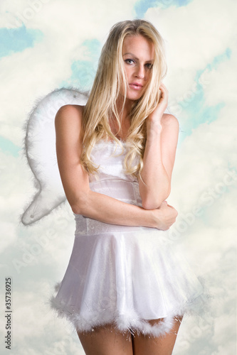 Photo: beautiful sexy woman as white snow angel beautiful sexy woman as white snow angel