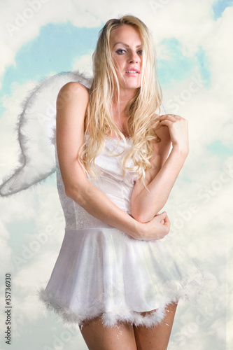 Photo: beautiful sexy woman as white snow angel beautiful sexy woman as white snow angel
