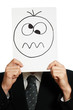 Man with the painted crazy smile on the paper over his face