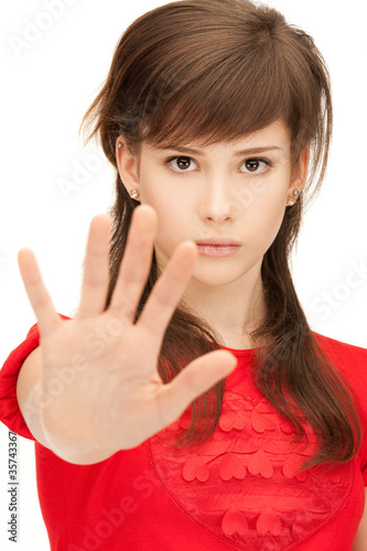 Photo: teenage girl making stop gesture teenage girl making stop gesture