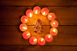 chirstmas candles circle over wood and symbol chirstmas candles circle over wood and symbol
