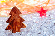 christmas tree with bark wood on winter ice christmas tree with bark wood on winter ice