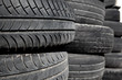 car tires pneus stacked in rows