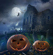 Pumpkins in graveyard with church ruins Pumpkins in graveyard with church ruins