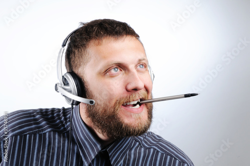 Photo: Charming Customer service agent with the pen Charming Customer service agent with the pen