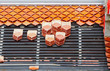 Repairing the roof of a temple in Thailand