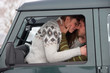 Young couple in car in snow