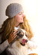 Young Girl with knitted cap and dog