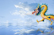 Golden dragon flying over the sea with nice sky background Golden dragon flying over the sea with nice sky background