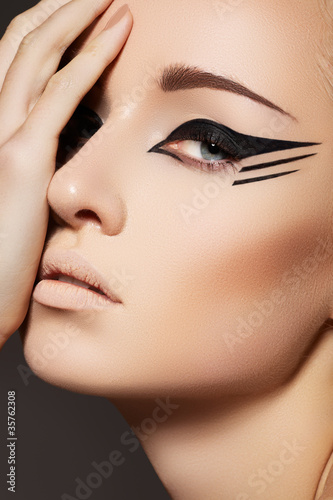 Photo: Fashion eyeliner makeup on model eyes. Sexy wild cat style Fashion eyeliner makeup on model eyes. Sexy wild cat style