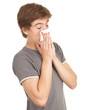 Photo: sick young man with flu blowing her nose, series sick young man with flu blowing her nose, series