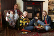 Photo: Young adults making toast on open fire Young adults making toast on open fire