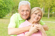 happy elderly man embracing mature woman happy elderly man embracing mature woman
