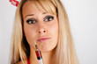 Young woman holding a syringe