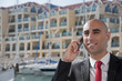 Business Man on the phone at the Marina Business Man on the phone at the Marina
