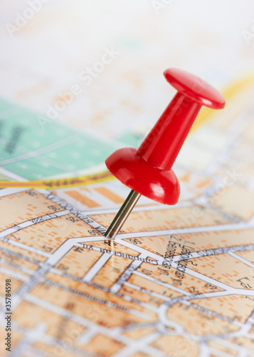 Photo: Red pushpin on a map Red pushpin on a map