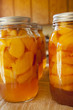 Glass jars of home canned peaches