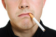 A man with a cigarette in his mouth.