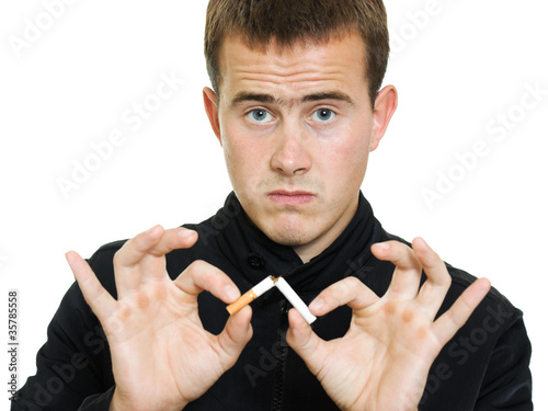 Photo: A man broke his cigarette. A man broke his cigarette.
