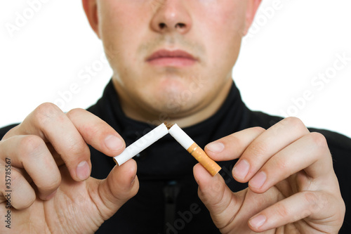 Photo: A man broke his cigarette. A man broke his cigarette.