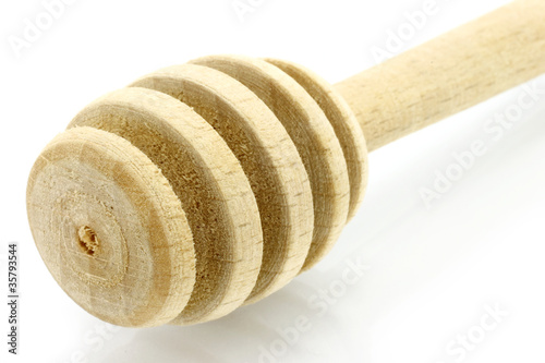 Photo: Wooden dipper on a white background Wooden dipper on a white background