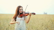 Young girl playing violin over nature Young girl playing violin over nature