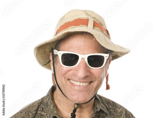 Photo: senior tourist wearing funny hat sunglasses senior tourist wearing funny hat sunglasses