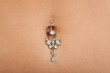 Closeup of a belly button (naval) that is pierced