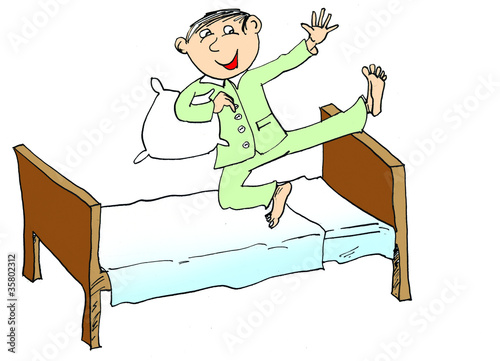 Photo: Young boy jumping on the bed Young boy jumping on the bed