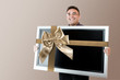 Man holding lcd tv Man holding lcd tv