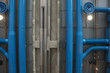 Ceiling pipes and ducts painted blue in industrial setting