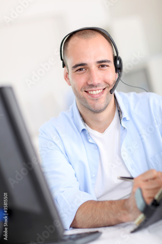 Photo: Portrait of cheerful customer service employee Portrait of cheerful customer service employee