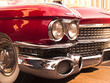 chrome radiator grill of red american classic car