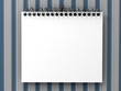 White blank notepad over striped wallpaper White blank notepad over striped wallpaper