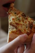 Person Eating Pizza