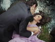 Loving couple laying on the grass