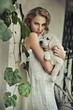 Photo: Young woman hugging her puppy Young woman hugging her puppy