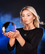 Young woman with crystal ball. Young woman with crystal ball.