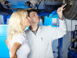 Motor mechanic explaining repair work to a customer