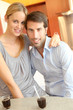 Happy young couple standing in home kitchen Happy young couple standing in home kitchen