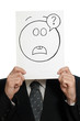 Painted misunderstanding face on paper over a face