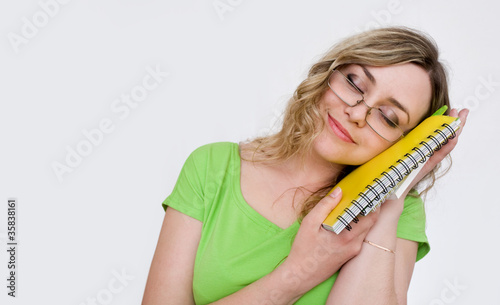 Photo: Attractive girl with a notebook Attractive girl with a notebook
