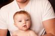 Young Dad in plain white shirt with baby girl