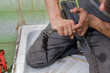 Plumber cleaning drain in bathroom with cable Plumber cleaning drain in bathroom with cable