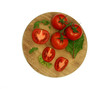 tomatoes and green salad on board isolated on white background
