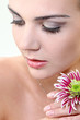 Attractive young woman face with flowers
