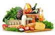 Groceries in wicker basket including vegetables and fruits