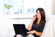Woman with  laptop and telephone